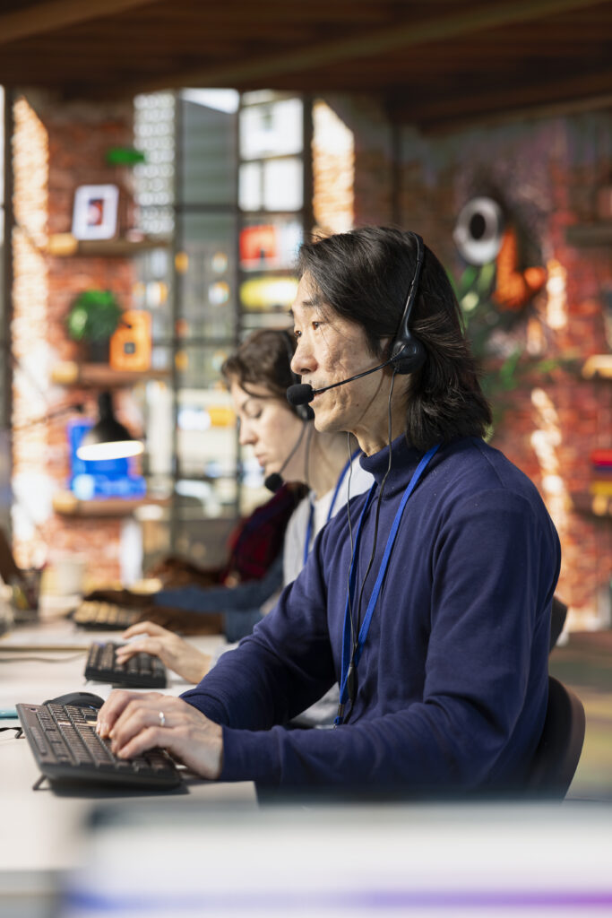 Call center agent in office helping customers by answering questions
